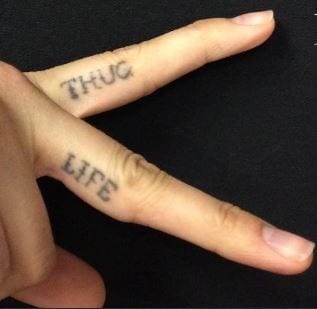 thug life tattoo on knuckles