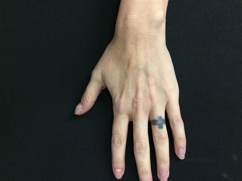 Hand with a Ring Finger Tattoo